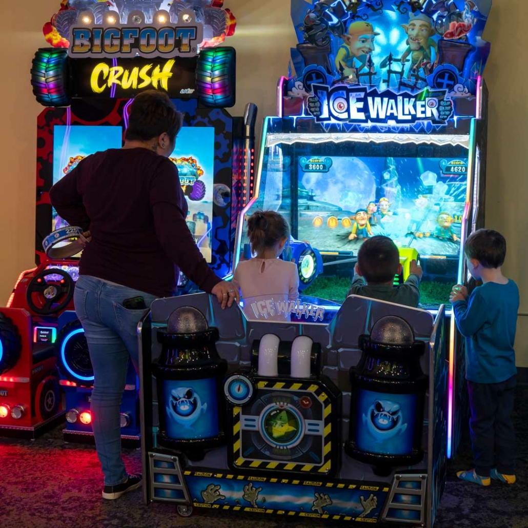 kids playing arcade games during a birthday party