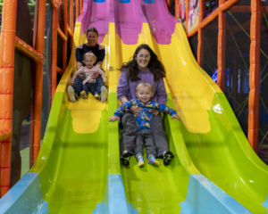 moms and kids on the slide